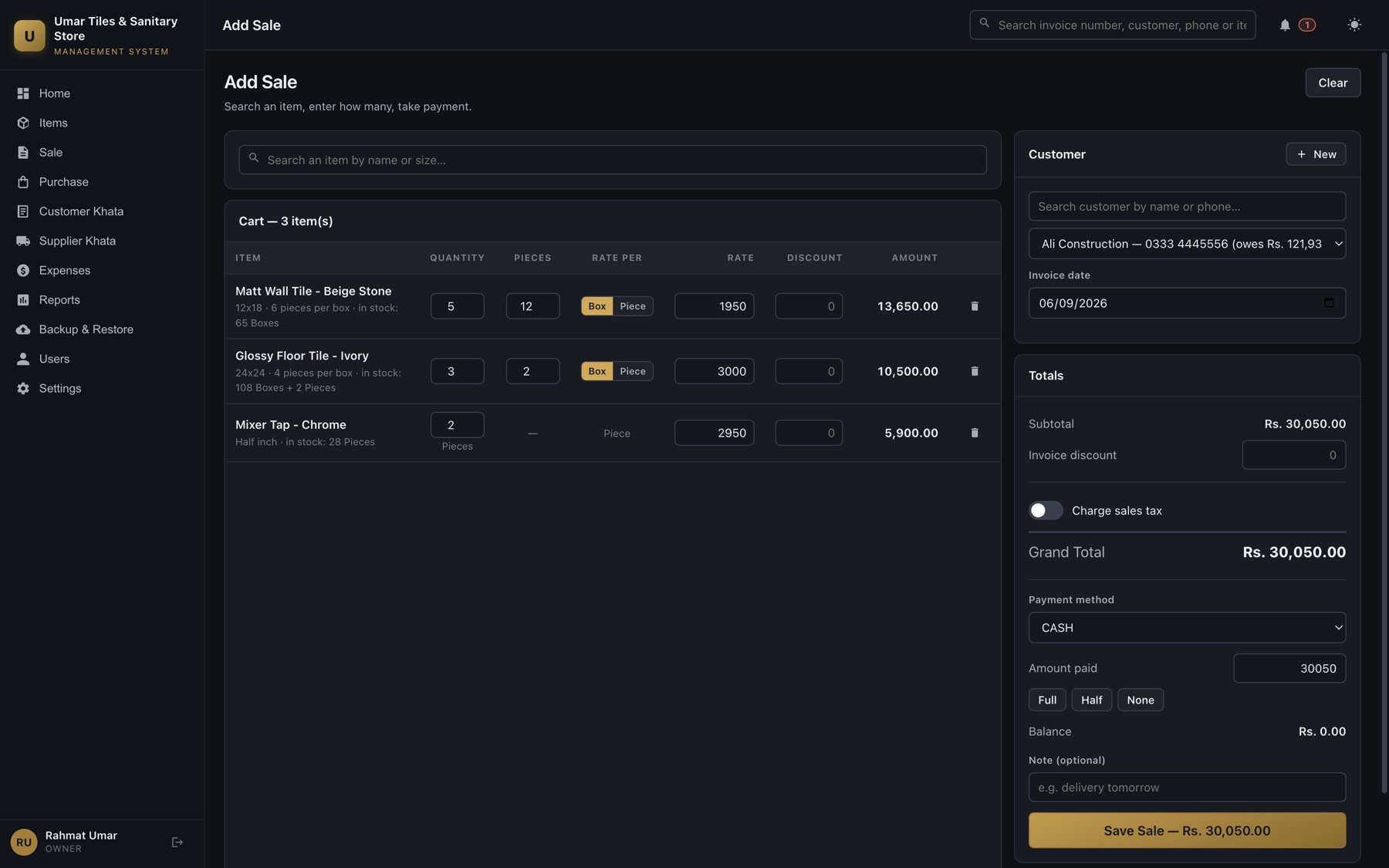 A sale in progress: three lines in the cart, each priced per box or per piece, with quantity entered as boxes plus loose pieces and the grand total, payment method and balance on the right.